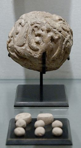 [Clay bulla with tokens, precursor to cuneiform script in Mesopotamia]